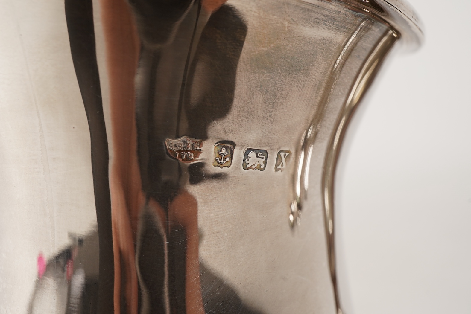 A George V four piece silver tea set, comprising teapot, hot water pot, sugar bowl and milk jug, by S. Blanckensee & Son Ltd